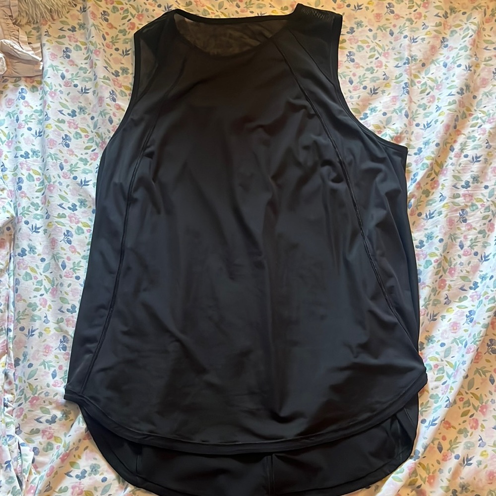 Lululemon tank top, sleeves are mesh, back is open at the top. Black! Size 12!